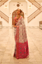 Load image into Gallery viewer, Chikoo Patola Printed Banarasi Silk Saree With Tassels